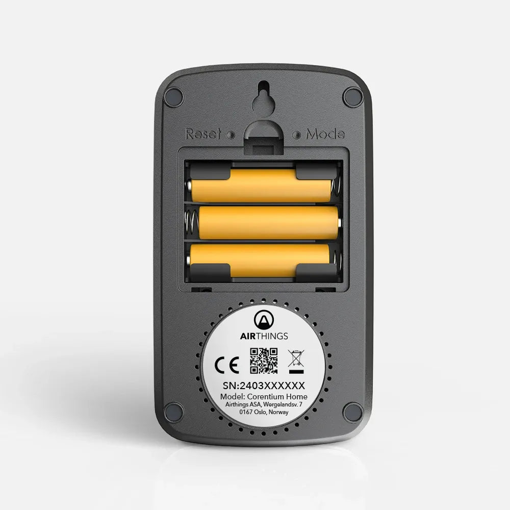 Back of Corentium Home: 3 AAA batteries and serial number label for warranty registration