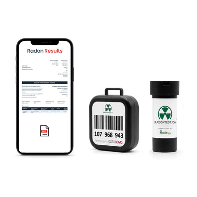 Both radon detectors side by side, with a results certificate shown on a phone